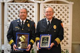Chief Daniel More" and President Clarence "Chip" Jewell with awards received at the FCVFRA Awards Ceremony 
