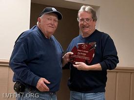 Jim Snyder is presented the "Chief's Award by Chief Dan More' at the annual awards ceremony.