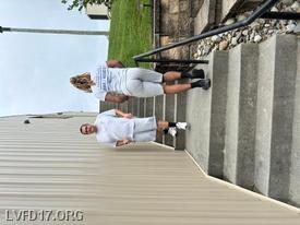 DFRS Firefighters Alex Hall and Elijah Brown climb the stairs at Libertytown in honor of the 343 FDNY firefighters. 